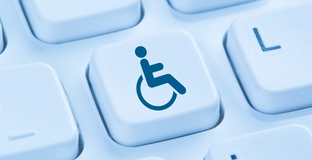 A handicap symbol on a desktop keyboard.