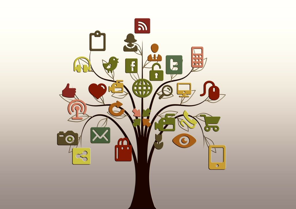 Digital marketing concept: a tree with branches that bears icons for various social media and ecommerce platforms.