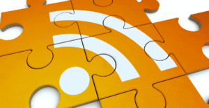 An RSS (Really Simple Syndication) icon is formed by connecting orange puzzle pieces.