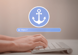 An anchor icon and URL bubble hover over a set of hands typing on a Bluetooth keyboard.