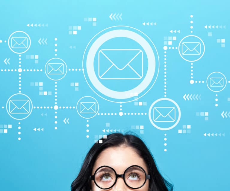 An illustrated email sequence hovers above a marketer's head.